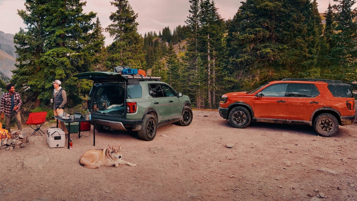 Two 2026 Honda Passport TrailSport parked with people camping