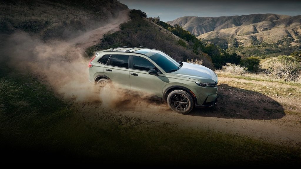 2026 Honda CR-V side view driving on a dirt road