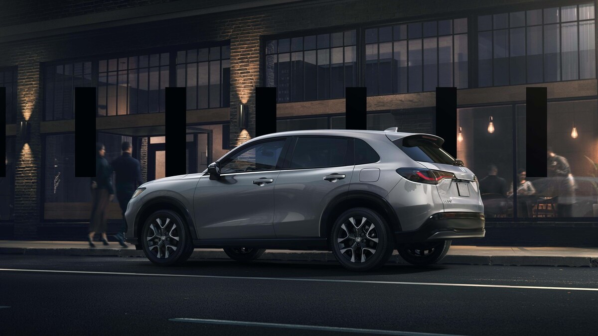2026 Honda HR-V parked on a city street at night.