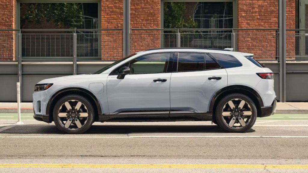 Side view of a 2026 Honda Prologue parked on a city street.